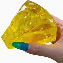 Squishy fromage miel à malaxer en texture souple jaune translucide en forme de fromage avec trous circulaires intégrés
