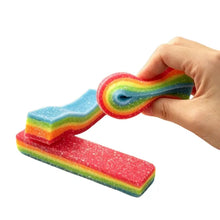 Jouet squishy ruban arc-en-ciel à étirer en éponge pailletée avec design ondulé coloré ressemblant à un bonbon