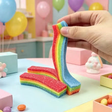 Jouet squishy ruban arc-en-ciel à étirer avec finition brillante et texture pailletée en bonbon sucré coloré
