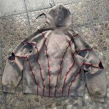 Sweat à capuche gothique gris avec motifs yeux et couture rouge en coupe ample avec cordons à la capuche