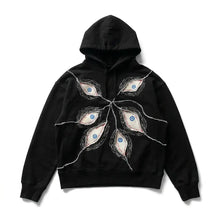 Sweat à capuche gothique noir à coupe ample avec motifs yeux brodés bleus en motif radial sur le devant