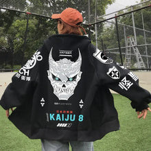 Sweat à capuche noir kaiju avec grand motif crâne blanc et teal kaiju 8 et patches japonaise sur manches