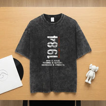 T-shirt coton noir distressed avec graphique 1984 et texte blanc george orwell design inspiré