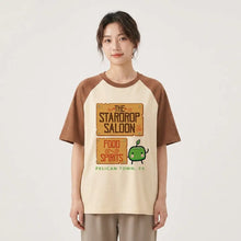 T-shirt stardew valley cream avec manches marron, graphisme stardrop saloon, pomme verte et texte food spirits