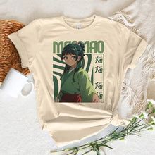 T-shirt beige manches courtes avec un personnage anime vert et rouge maomao imprimé les carnets de l apothicaire