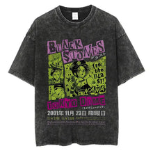 T-shirt manga rock vintage en coton noir distressed avec imprimé graphique vibrant anime et détails de concert rose vert