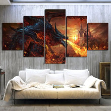 Tableau mural dragon wing of death en 5 panneaux représentant un dragon sombre crachant du feu sur un château en flammes