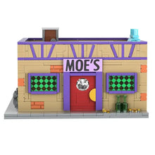 Modèle en plastique abs taverne cartoon colorée en briques avec murs tan, fenêtres vertes et porte rouge skull