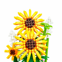 Bouquet de tournesols jaunes en briques lego avec centres marron détails et tiges vertes sous cloche transparente avec led à lumière chaude
