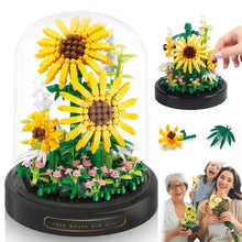 Bouquet de tournesols jaune vif en briques plastique sous cloche transparente avec led à lumière chaude sur socle noir