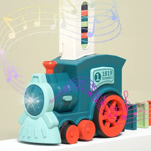 Train électrique poseur rose avec train en plastique teal et orange et tour domino musicale 1819 domino sur le dos