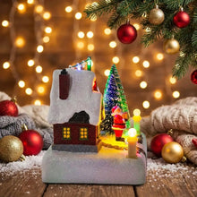 Village de noël lumineux avec père noël, maison rouge enneigée et dimensions annoncées pour décoration festive