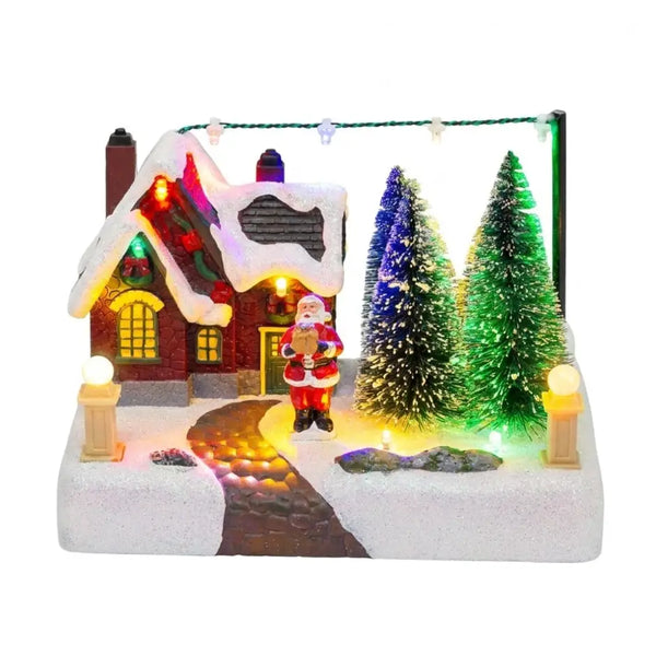 Village de Noël lumineux avec sapins et Père Noël