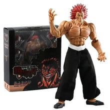 Figurine articulée yujiro hanma baki 20,5 cm avec cheveux rouges en pics et pantalon noir à côté de son emballage